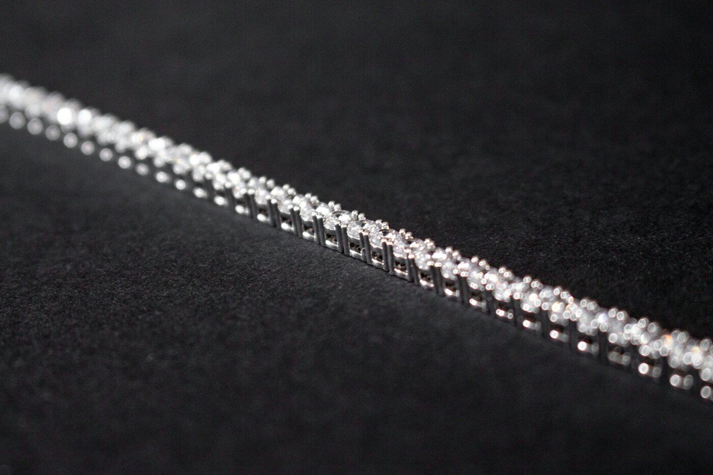 Diamond line chain laid on black fabric